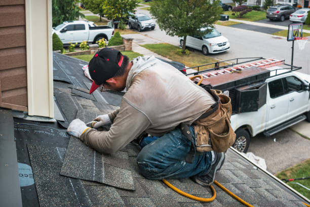 Professional Roofing technician working in Elba, NY